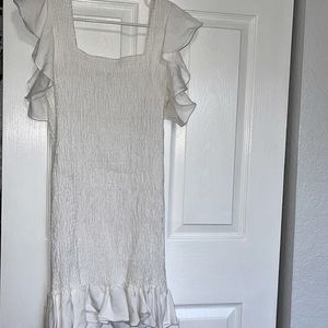 Fitted popcorn style frill sleeve and bottom hem